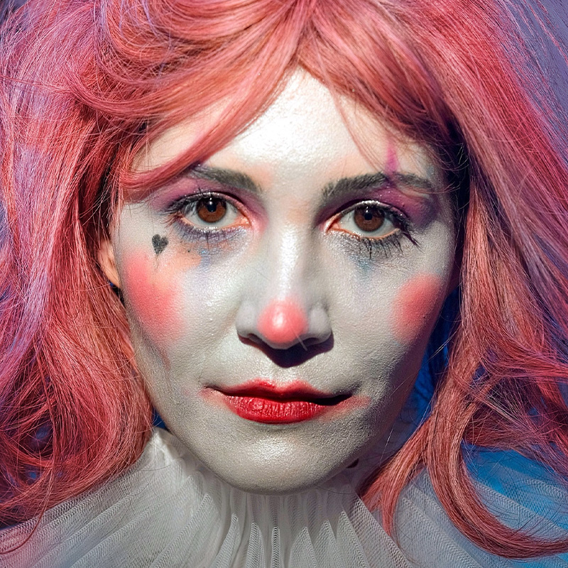 Feride in the pink-wigged character portrait for Chickadee