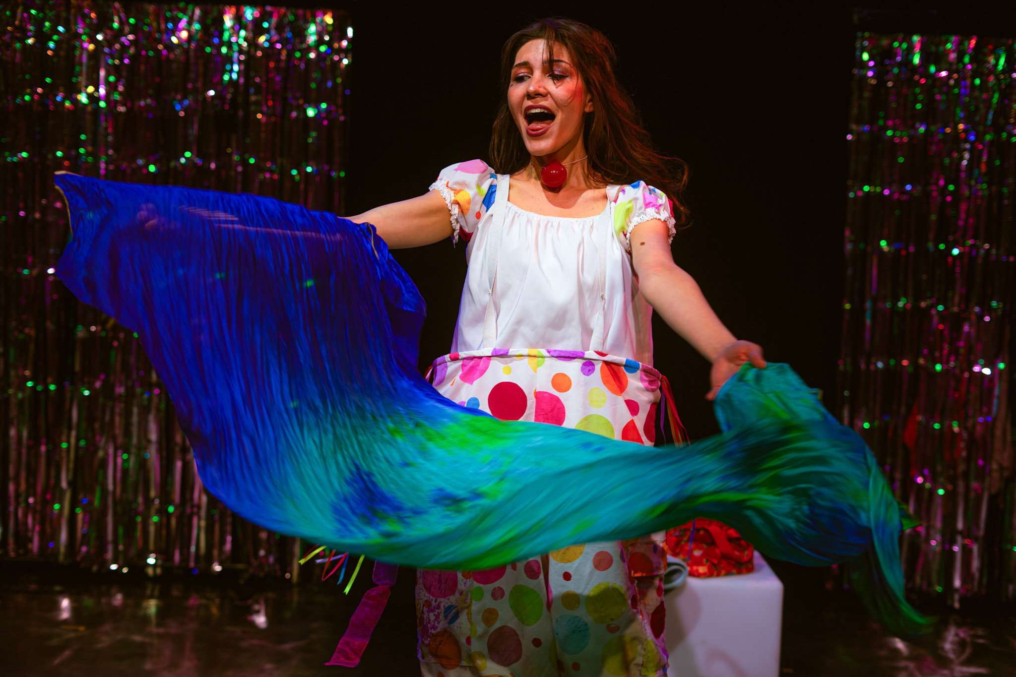 Feride performing Chickadee with flowing blue and green fabric